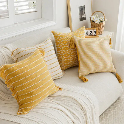 Geometric tufted yellow cushion cover with crochet tassels living room