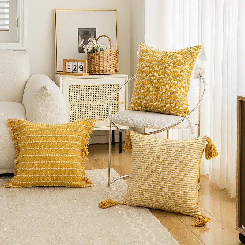 Geometric tufted yellow cushion cover with crochet tassels living room