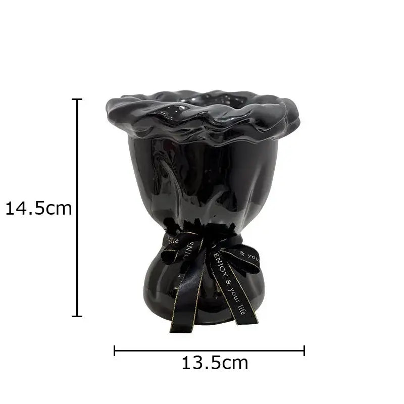 Glossy black ceramic vase with pink artificial flowers bedroom decor