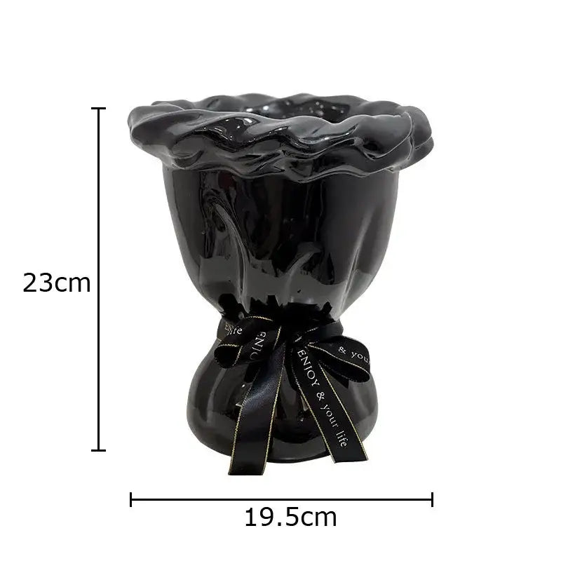 Glossy black ceramic vase with pink artificial flowers bedroom decor