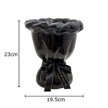 Glossy black ceramic vase with pink artificial flowers bedroom decor