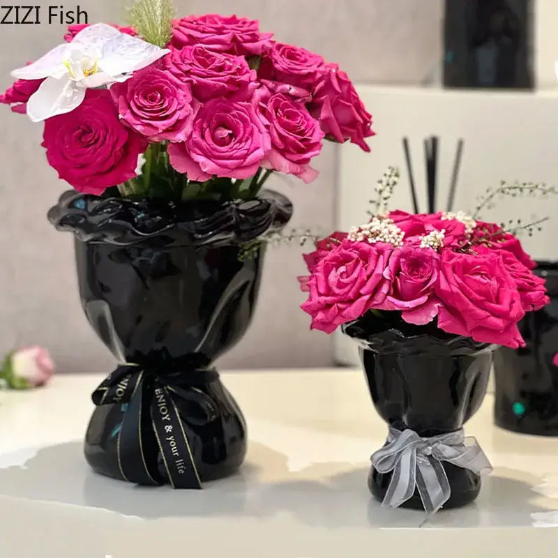 Glossy black ceramic vase with pink artificial flowers bedroom decor