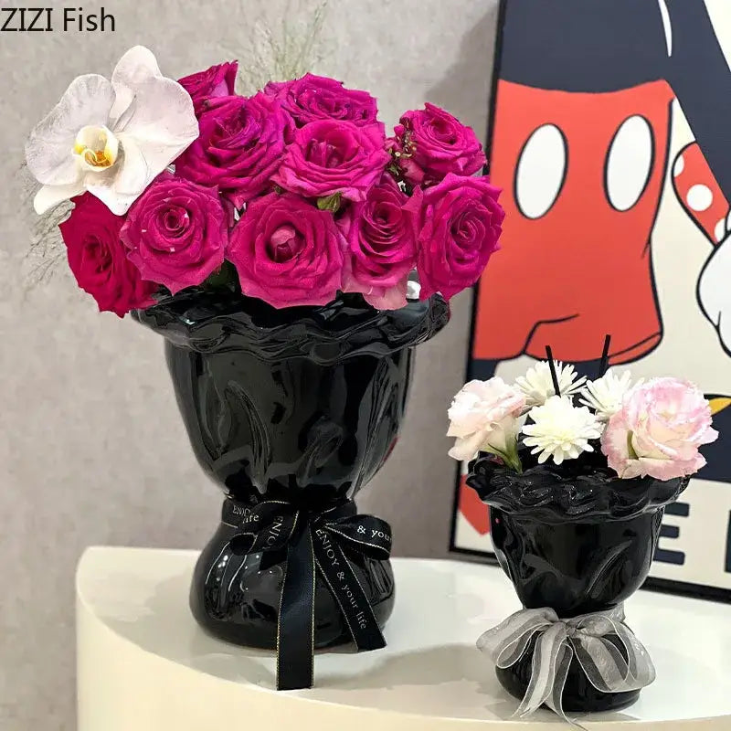 Glossy black ceramic vase with pink artificial flowers bedroom decor