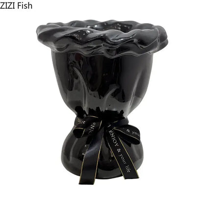 Glossy black ceramic vase with pink artificial flowers bedroom decor