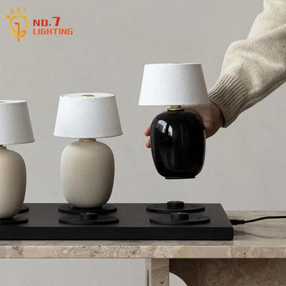 Glossy black ceramics table lamp with white shade for bedroom