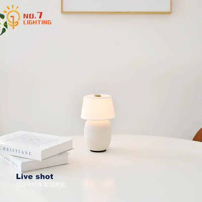 Glossy black ceramics table lamp with white shade for bedroom