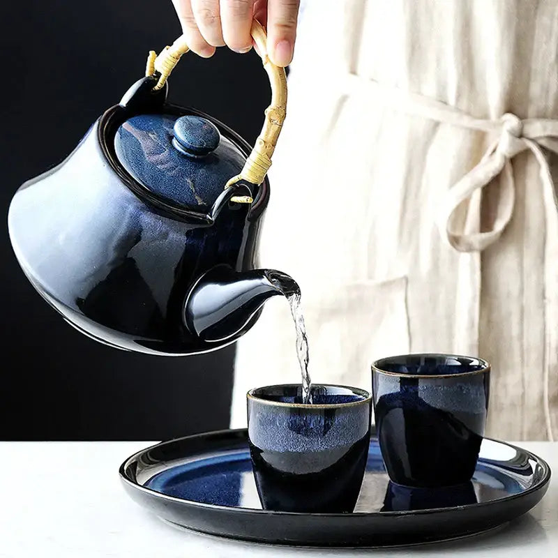 Glossy blue ceramic tea kettle set with bamboo handle dining room
