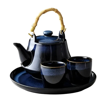 Glossy blue ceramic tea kettle set with bamboo handle dining room