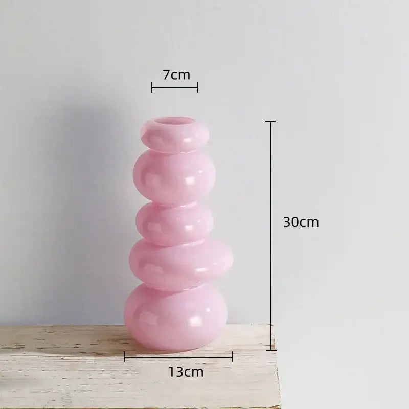 Glossy pastel pink pebble stack floral arrangement living room vase