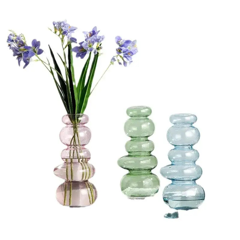 Glossy pastel pink pebble stack floral arrangement living room vase