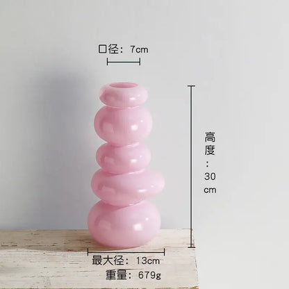 Glossy pastel pink pebble stack floral arrangement living room vase