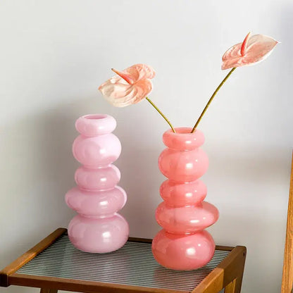 Glossy pastel pink pebble stack floral arrangement living room vase