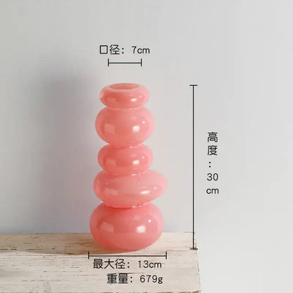 Glossy pastel pink pebble stack floral arrangement living room vase