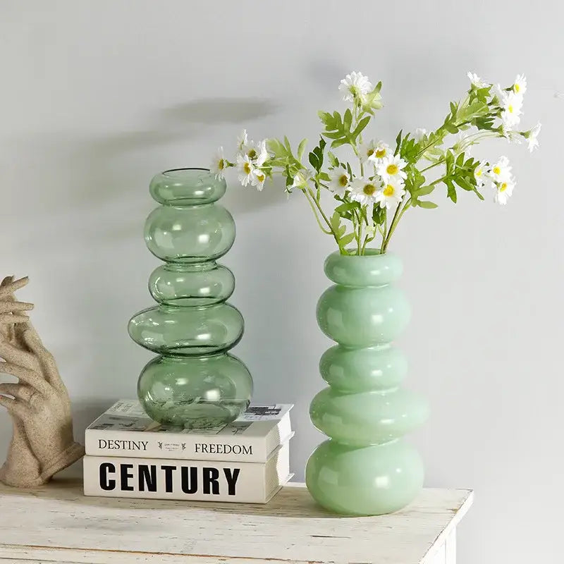 Glossy pastel pink pebble stack floral arrangement living room vase