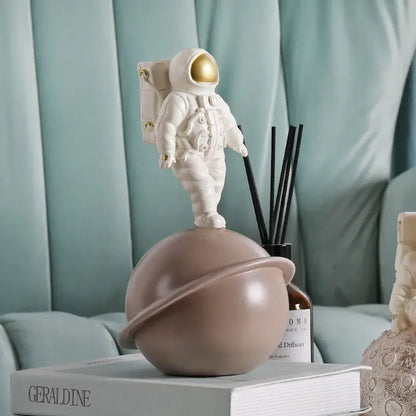 Glossy white and gold astronaut phone holder bedroom decor sculpture