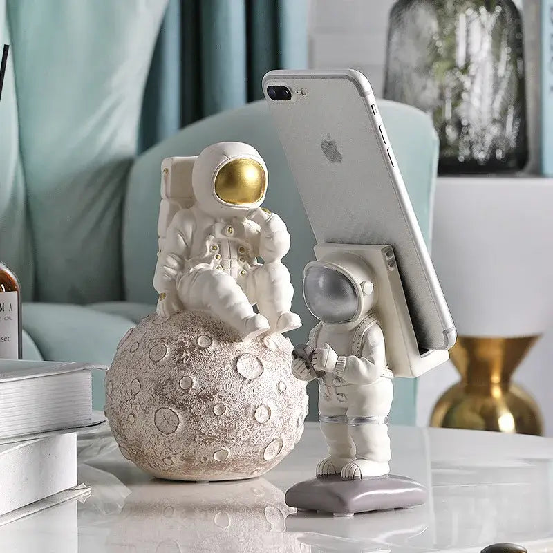 Glossy white and gold astronaut phone holder bedroom decor sculpture