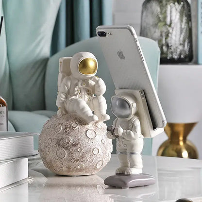 Glossy white and gold astronaut phone holder bedroom decor sculpture