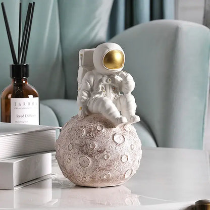 Glossy white and gold astronaut phone holder bedroom decor sculpture