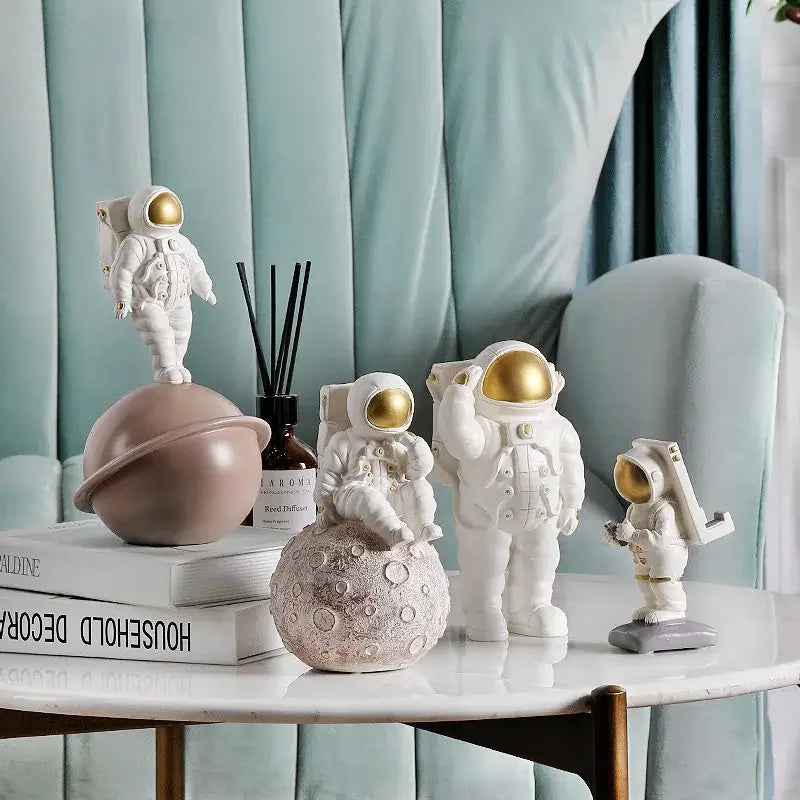 Glossy white and gold astronaut phone holder bedroom decor sculpture