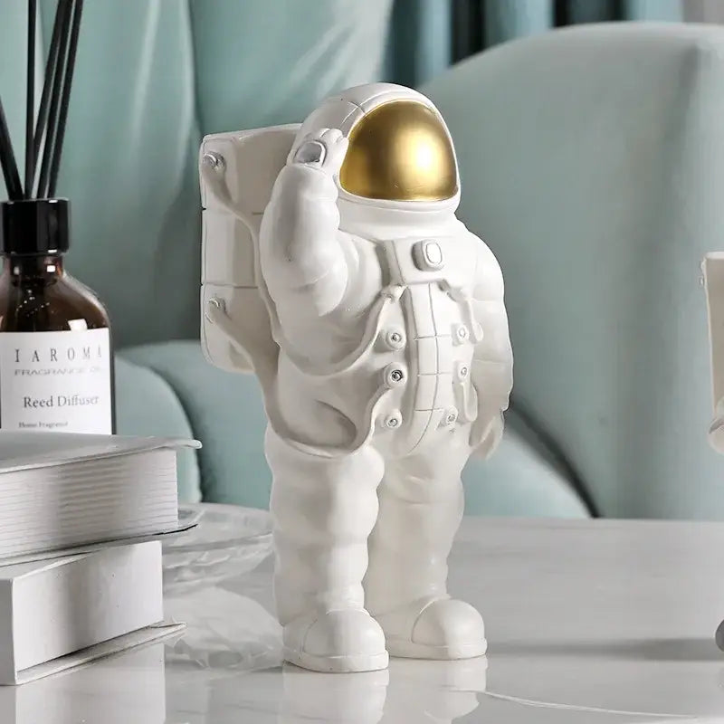 Glossy white and gold astronaut phone holder bedroom decor sculpture