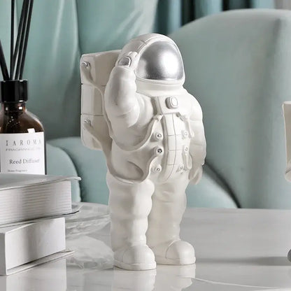 Glossy white and gold astronaut phone holder bedroom decor sculpture