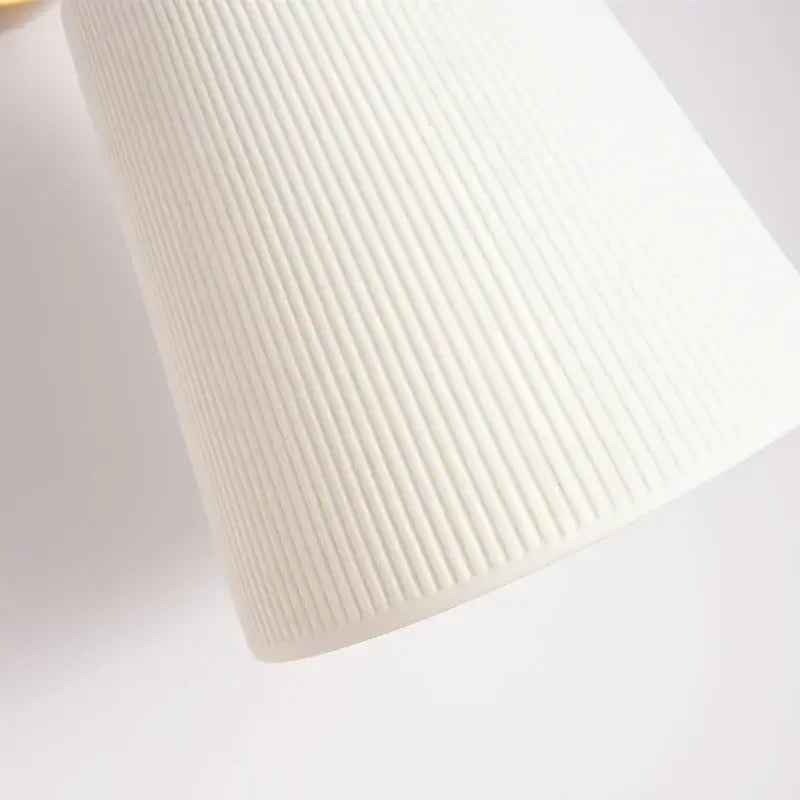 Gold ceramic led wall lamp with ribbed fabric shade for living room
