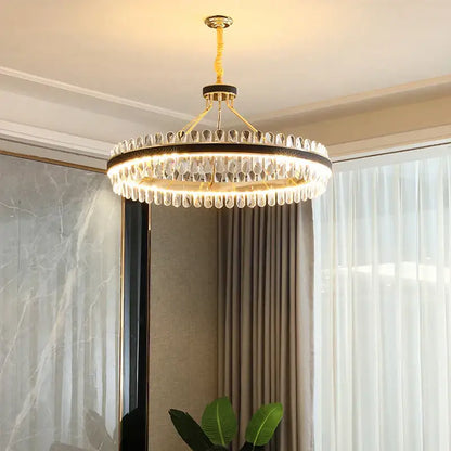 Gold stainless steel crystal chandelier dining room leather detail