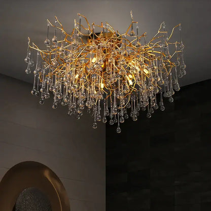 Gold tree branch chandelier with crystal droplets for dining room