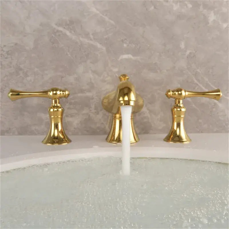 Gold widespread bathroom faucet waterfall design with lever handles