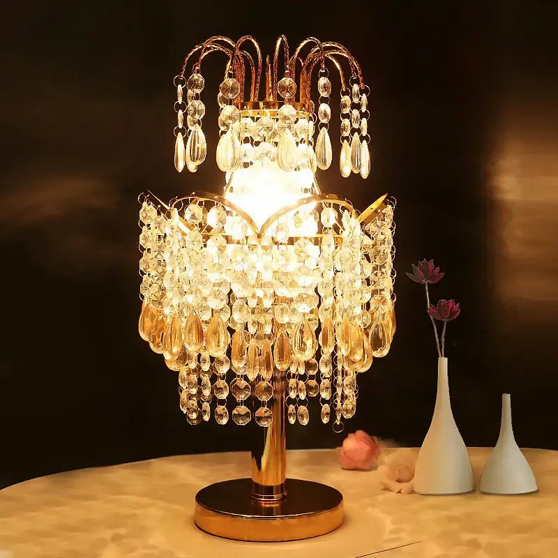 Golden crystal table lamp with teardrop accents for bedroom decor