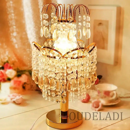 Golden crystal table lamp with teardrop accents for bedroom decor