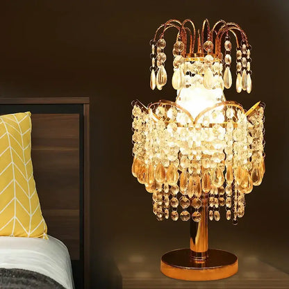 Golden crystal table lamp with teardrop accents for bedroom decor