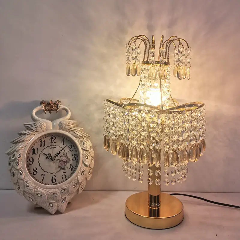 Golden crystal table lamp with teardrop accents for bedroom decor