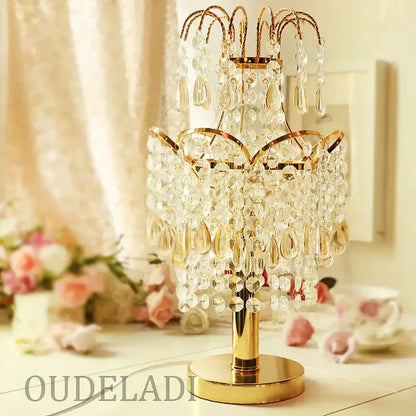 Golden crystal table lamp with teardrop accents for bedroom decor