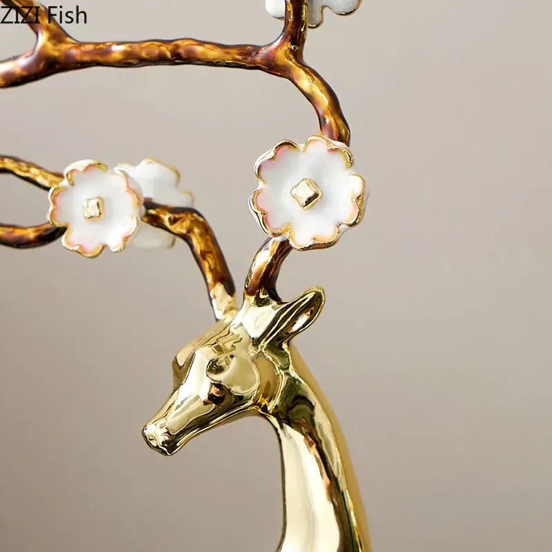 Golden deer antlers statue with white blossoms living room decor