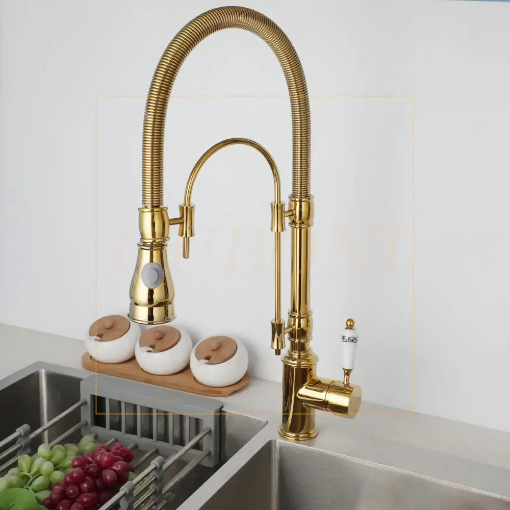 Golden kitchen faucet with white ceramic handle and swivel spout