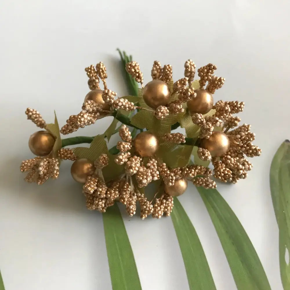 Golden metallic berry stamen green plant foliage for living room decor
