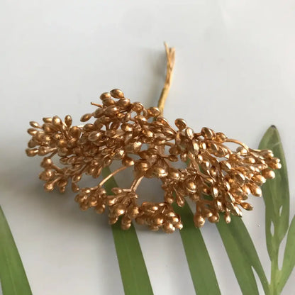Golden metallic berry stamen green plant foliage for living room decor