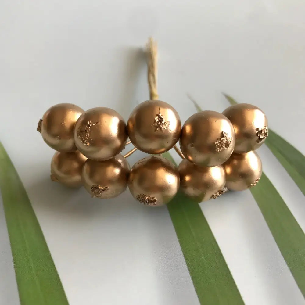 Golden metallic berry stamen green plant foliage for living room decor