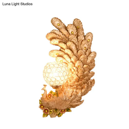 Golden peacock wall light with crystal shade – living room yellow & green