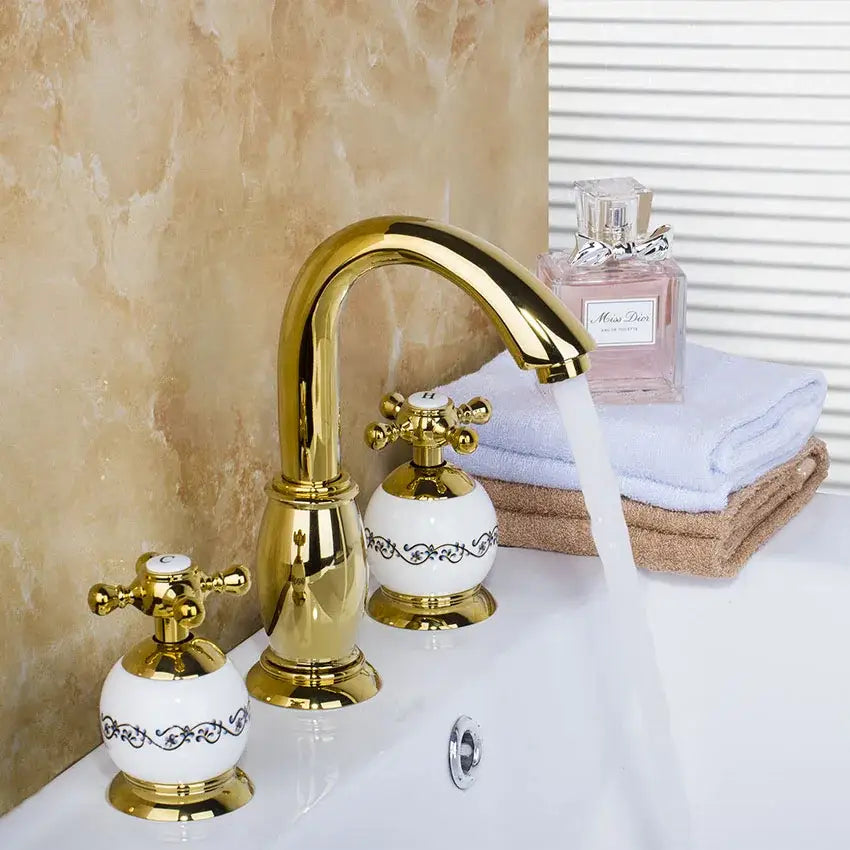 Golden plated bathroom faucet set with white ceramic handles