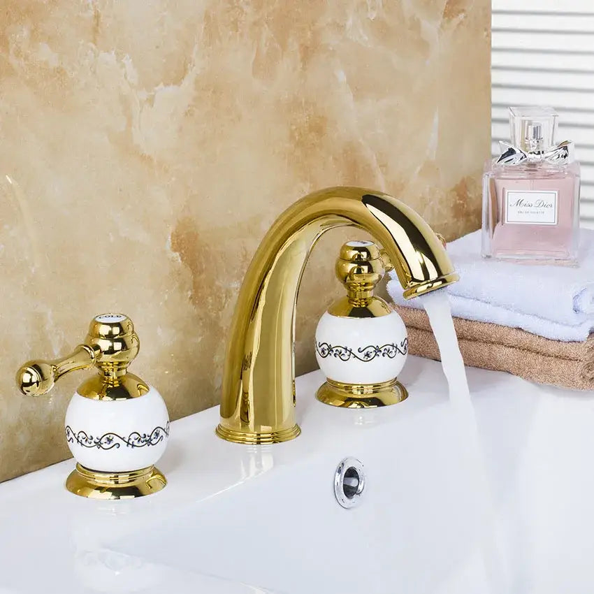 Golden plated bathroom faucet set with white ceramic handles