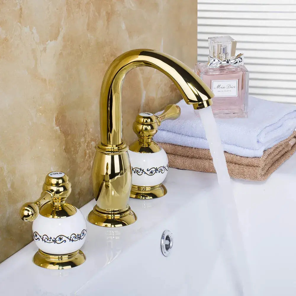 Golden plated bathroom faucet set with white ceramic handles