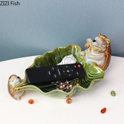 Green ceramic leaf decor tray with porcupines for dining room storage