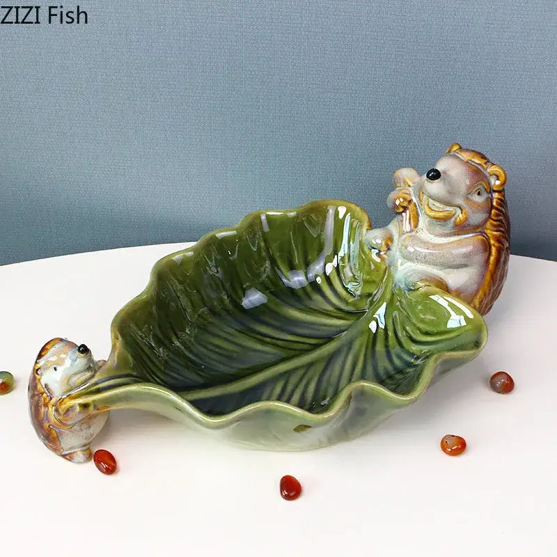 Green ceramic leaf decor tray with porcupines for dining room storage