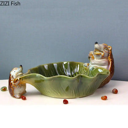 Green ceramic leaf decor tray with porcupines for dining room storage