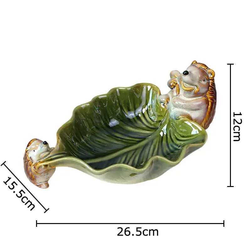 Green ceramic leaf decor tray with porcupines for dining room storage