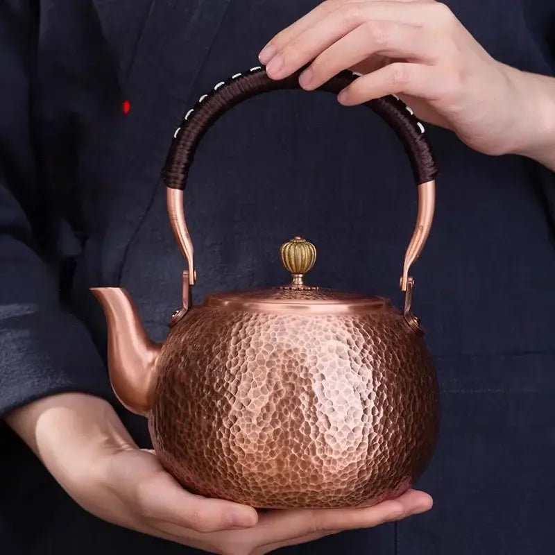 Handmade hammered copper tea pot with knitting handle dining room set
