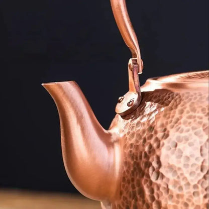 Handmade hammered copper tea pot with knitting handle dining room set