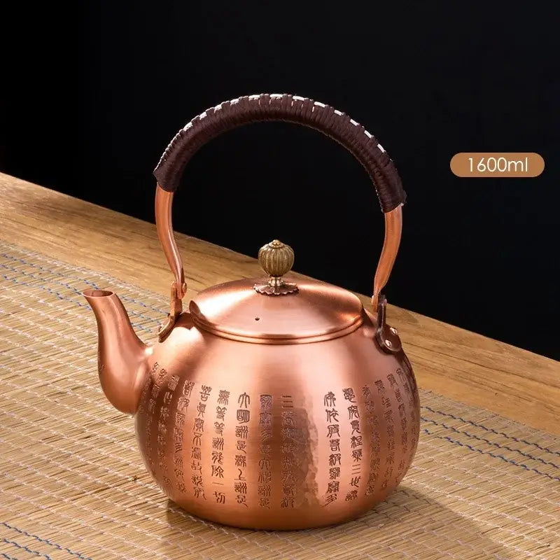 Handmade hammered copper tea pot with knitting handle dining room set